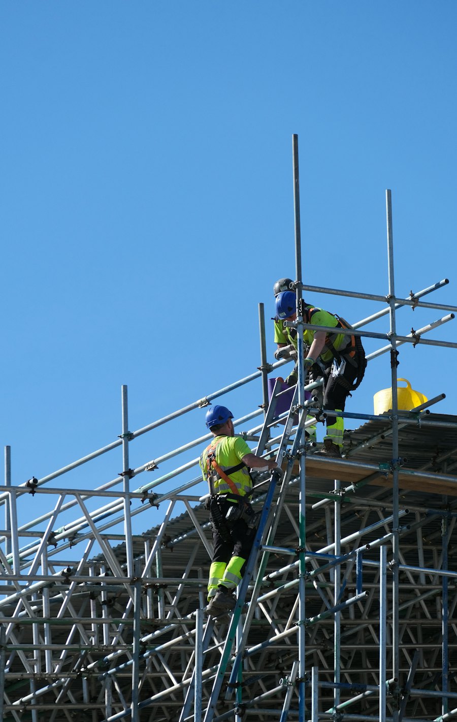 Two workers on scaffolding