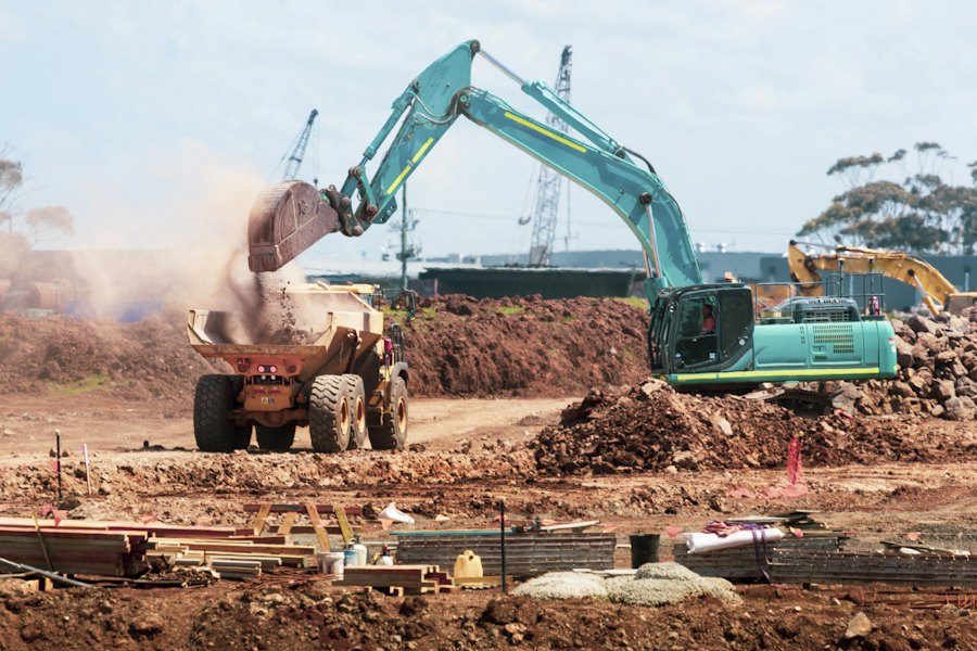 Excavator loading a dump truck